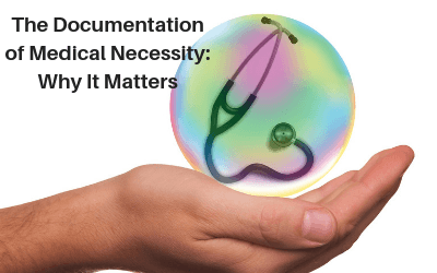 hand with a ball on top of it with a stethoscope in it; The Documentation of Medical Necessity: Why it Matters